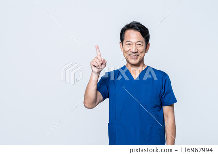 A middle-aged doctor wearing a scrub A middle-aged doctor wearing a scrub 116967994