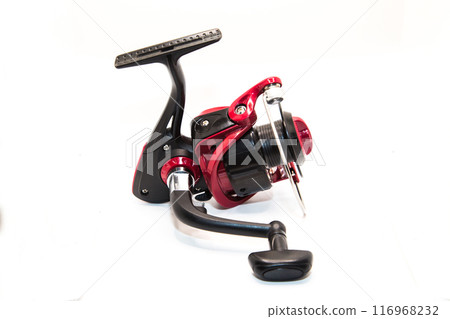 Red fishing reel for rod and spinning on white background 116968232