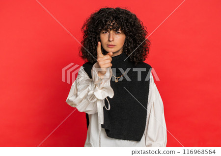 Irritated displeased aggressive unhappy woman gesturing hands blaming scolding for failure problem 116968564