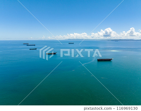 Sea bay with cargo and merchant ship. Seascape. Mindanao, Philippines. Sea bay with cargo and merchant ship. Seascape. Mindanao, Philippines. 116969130