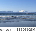 Snow-capped Mt. Fuji and the calm sea as seen from Katase Beach 116969236