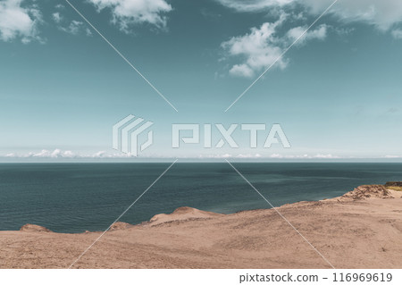 Sand dunes and seascape next to Rubjerg Knude Lighthouse. Sand dunes and seascape next to Rubjerg Knude Lighthouse. 116969619