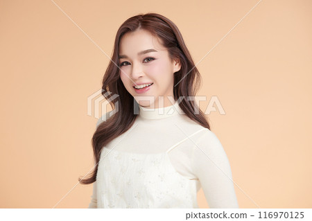 Beautiful young asian woman with clean fresh skin on beige background, Face care, Facial treatment, Cosmetology, beauty and spa, Asian women portrait. 116970125