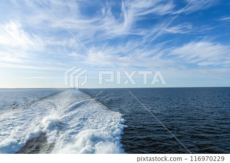 Water trail behind cruise ship. Summer travel concept. 116970229