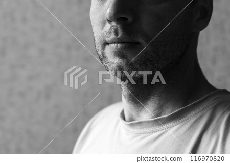 Unshaven chin of an European man, black and white 116970820