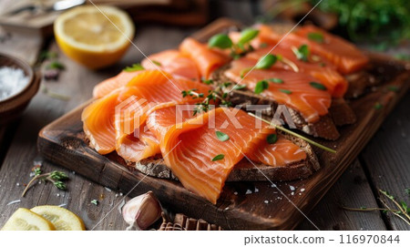 Salmon sandwiches with bagel, salted fish, fresh cucmber, onion and basil on white background. Healthy breakfast with salmon toasts 116970844