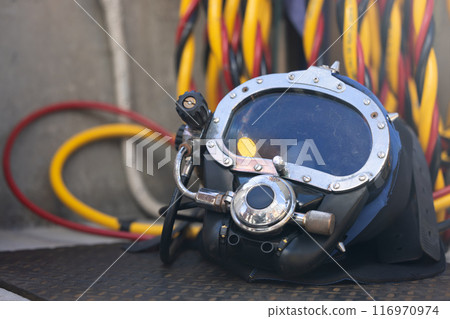 Closeup of commercial diving helmet on the boat Closeup of commercial diving helmet on the boat 116970974
