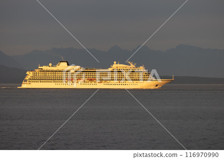 Cruise ship sailing at sunset 116970990