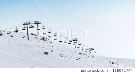 Ski lift on snowy slope at ski resort Ski lift on snowy slope at ski resort 116971744