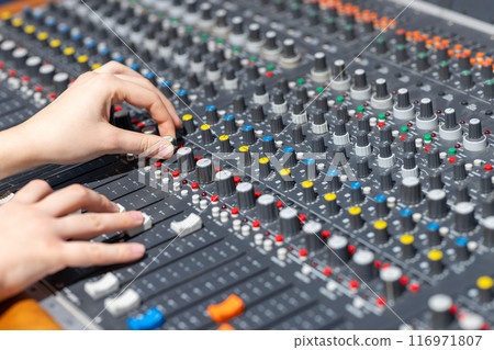 Closeup of audio mixer control panel 116971807