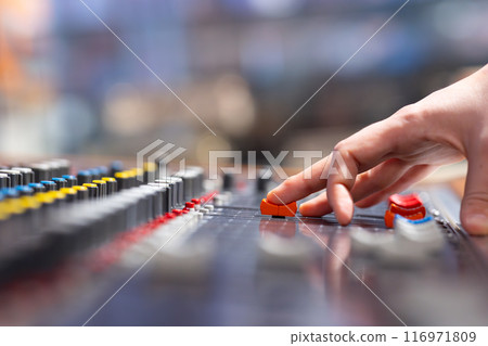 Closeup of audio mixer control panel 116971809