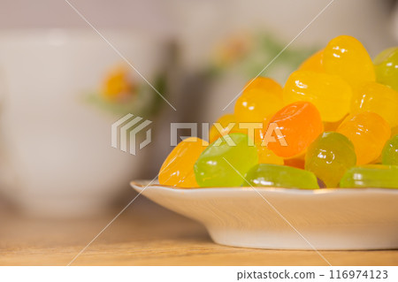 Colorful hard candy on a saucer 116974123