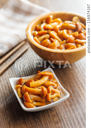 Pickled nameko mushrooms.Traditional japanese mushrooms in bowl on wooden table. 116974167