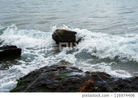 waves crashing on rocky shoreline waves crashing on rocky shoreline 116974406