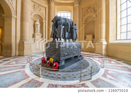 The final resting place of Marshal Foch, located inside the historic Les Invalides in Paris, adorned with wreaths and sculptures. Paris, France 116975018