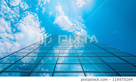 人工智慧產生的圖像，從下方仰視的角度，真實地描繪了一座延伸到藍天的現代摩天大樓。 116978164