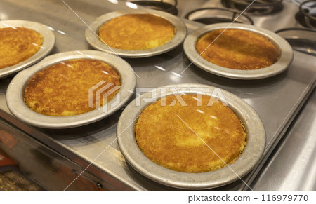 Knafeh Food, Sweet Cheese Pastry Made With Kadaifi, Traditional Arabic Dessert. Delicious Turkish Delight Kunefe On Metal Plate Behind Glass Case. Selective Focus, Horizontal Plane, 116979770