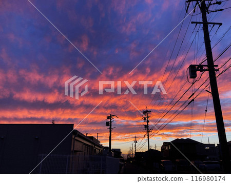 Sunset seen from a residential area 116980174