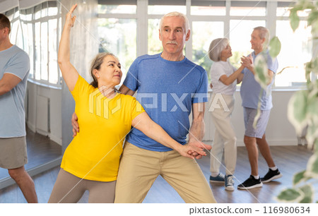 Couple of elderly man and woman dancing waltz 116980634