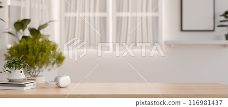 A space for displaying products on a wooden tabletop in a minimalist white room. 116981437