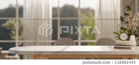 A space for displaying products on a minimalist dining table in a Scandinavian dining room. 116981443