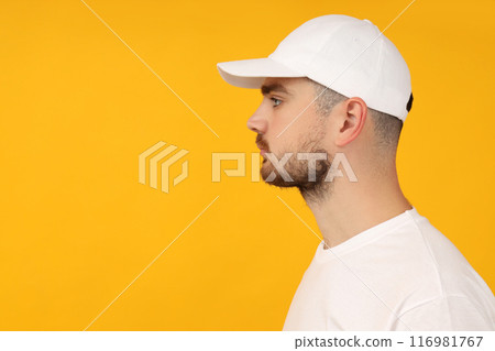 A young guy in a white T-shirt and a white cap 116981767
