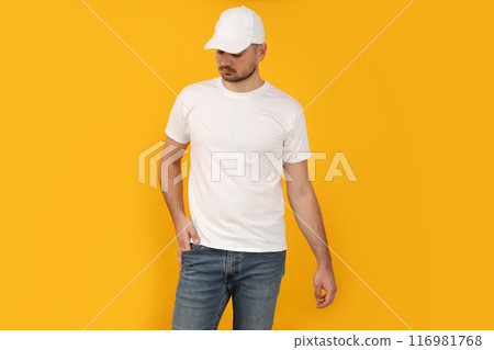 A young guy in a white T-shirt and a white cap 116981768