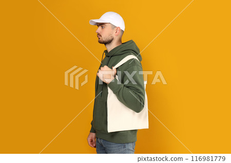 A guy in a thick coat with a bag on his shoulder 116981779