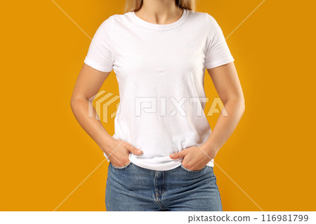 A young woman in a white T-shirt A young woman in a white T-shirt 116981799