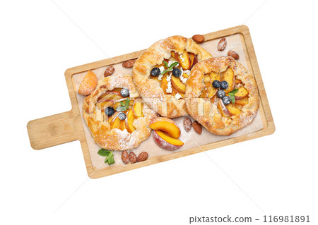 PNG, Fruit galettes on wooden kitchen board, isolated on white background, top view 116981891