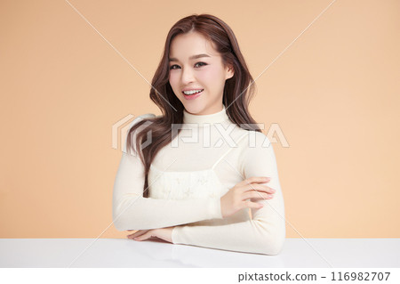Beautiful young asian woman with clean fresh skin on beige background, Face care, Facial treatment, Cosmetology, beauty and spa, Asian women portrait. 116982707