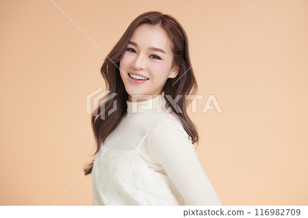 Beautiful young asian woman with clean fresh skin on beige background, Face care, Facial treatment, Cosmetology, beauty and spa, Asian women portrait. 116982709
