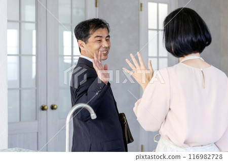 Morning goodbye middle-aged couple 116982728