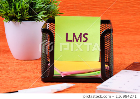 LMS stands for Learning Management System. LMS word on a light green ticker in front of an orange background 116984271