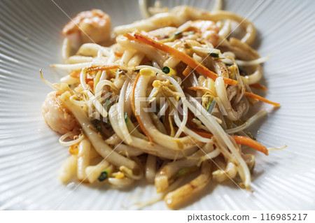 Nice Stir-fried Yaki Udon noodles with shrimps fish, vegetables and soy-based sauce Nice Stir-fried Yaki Udon noodles with shrimps fish, vegetables and soy-based sauce 116985217
