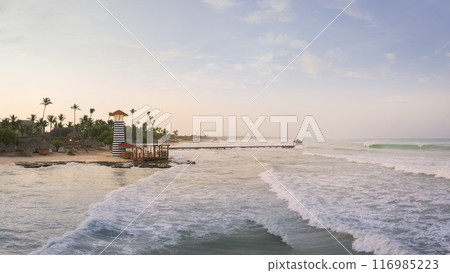 Drone shot of Bayahibe beach at sunset rough sea and luxury beach 116985223
