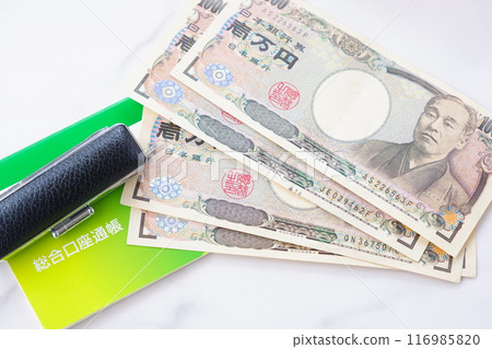 A bankbook, a seal, and a 10,000 yen note on a table A bankbook, a seal, and a 10,000 yen note on a table 116985820