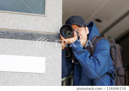 A man with a camera A man with a camera 116986150