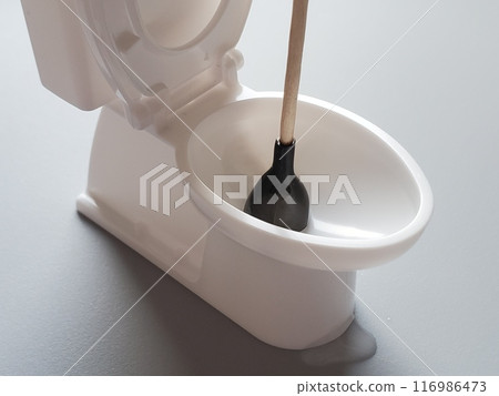 Image of a rubber plunger used to fix a clogged toilet leak Image of a rubber plunger used to fix a clogged toilet leak 116986473