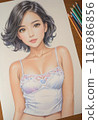 A cute girl with short hair is smiling in a relaxed pose wearing pastel lingerie. 116986856