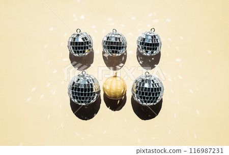 Arrangement of disco balls and tiny pumpkin. 116987231