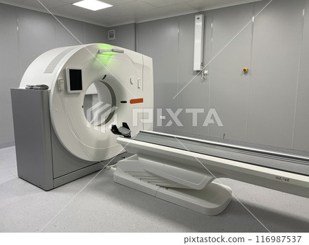 Modern hospital Computed Tomography room interior with device 116987537
