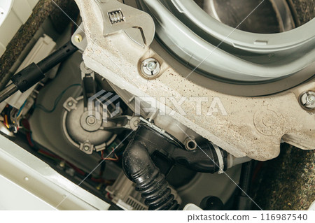 Gasket mount of a front loading washing machine being serviced without front cover, disassembled Gasket mount of a front loading washing machine being serviced without front cover, disassembled 116987540