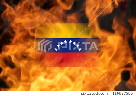 Fire and turmoil during Venezuela protests. Flag of Venezuela on fire flame background Fire and turmoil during Venezuela protests. Flag of Venezuela on fire flame background 116987590