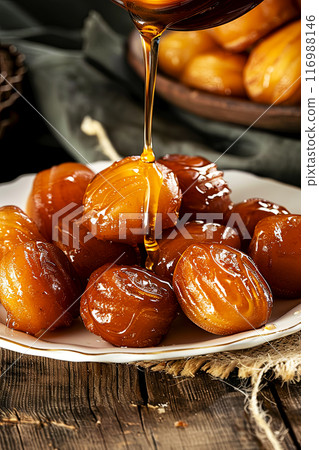 Turkish dough sweets drizzled with honey, sweet dough balls fried in oil on table, top view with concept space 116988146