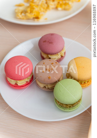 Delicious breakfast with oatmeal and macaroons. Delicious breakfast with oatmeal and macaroons. 116988897