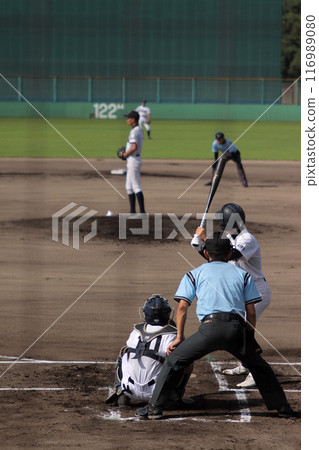 A baseball player chasing a white ball A baseball player chasing a white ball 116989080