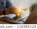 Casual Businessman Touch Mobile Phone and 2023 Stock Market Bar Chart or Graph Trend 116989128