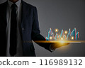 Businessman Hold Tablet and Color Stock Market Graph and Cryptocurrency 116989132