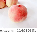 Close-up of a single peach. Peaches in the background. 116989361
